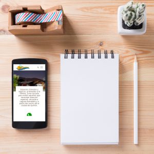 Topview of office stuff on wooden working table. Mock up. Sticky tape, note paper , white blank notebook, post-it note, pencil and blank white screen smartphone.