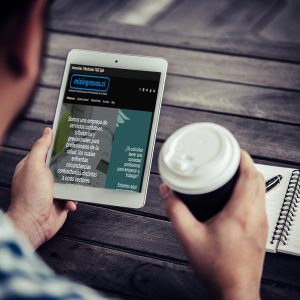 Young man using digital tablet while drinking Coffee sitting at home garden, Relaxing in the morning.
